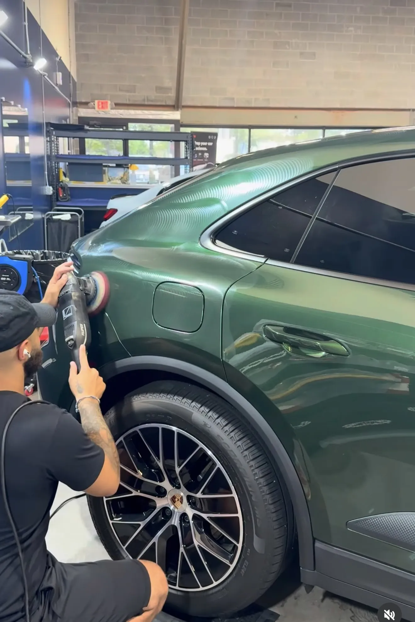 Machine polishing a green Porsche Macan EV
