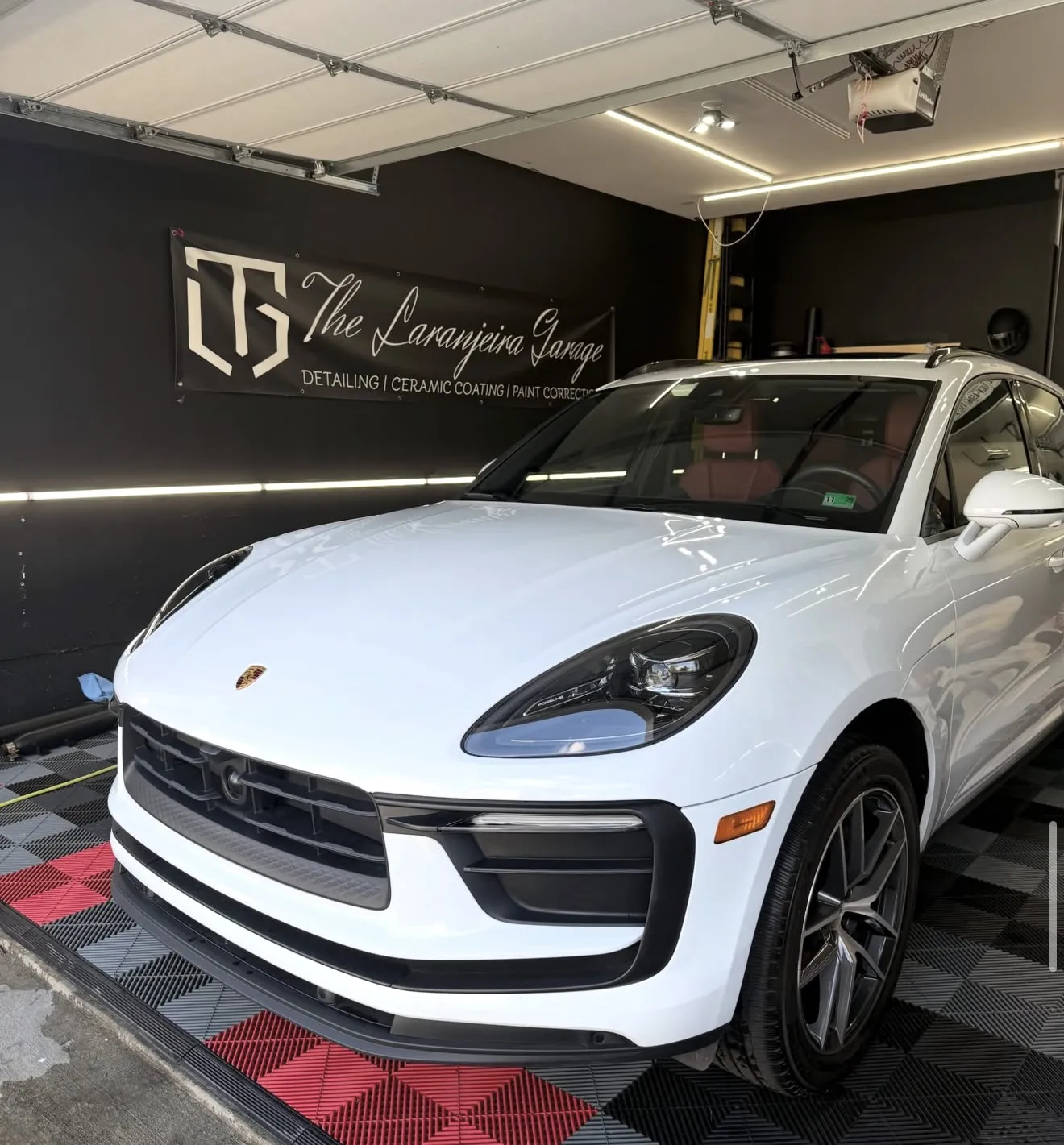White Porsche Macan after a maintenance detail